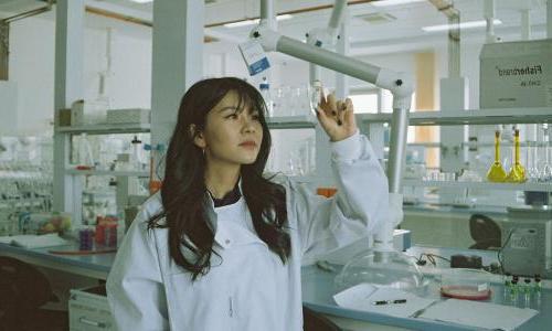 Scientist in white lab coat in a lab